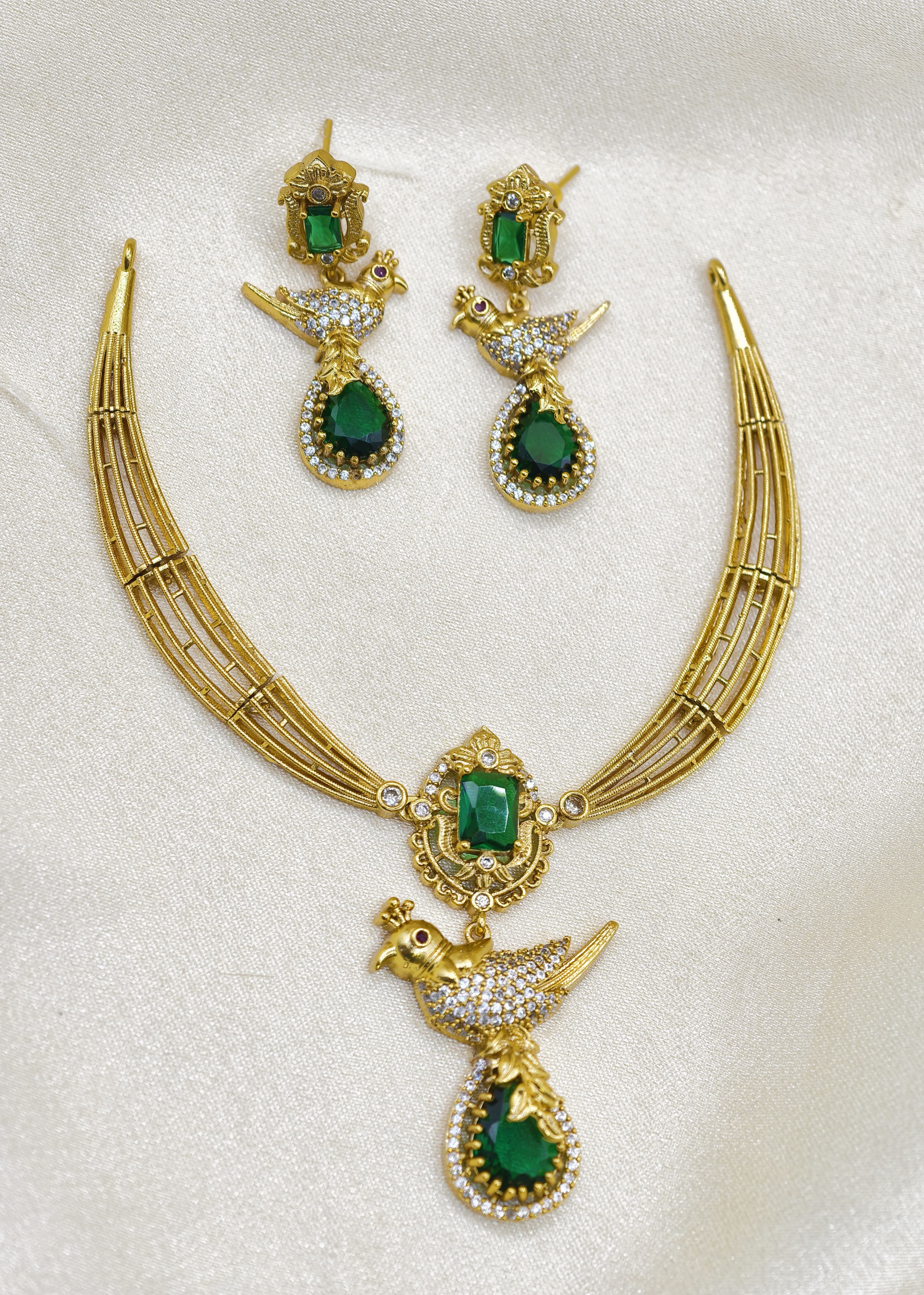 Short necklace set with small bird locket.